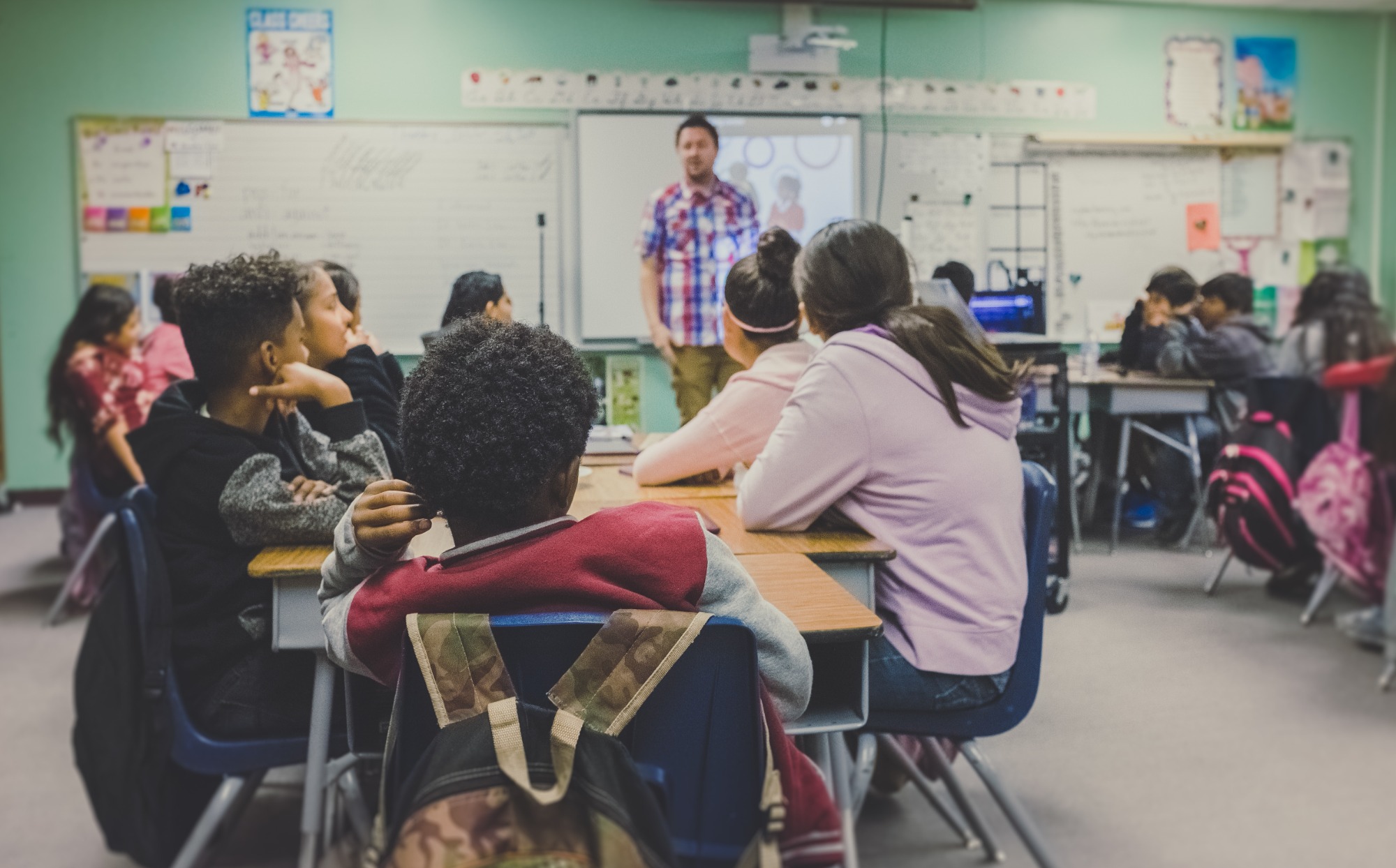 students and a teacher in a classroom