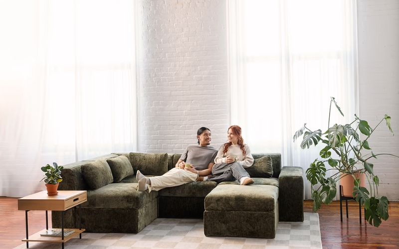 Low-profile modular sectional in neutral fabric